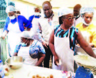 Participants with composite flour products and drop doughnut prepared from sweet potato, HQCF and plantain flour. Image